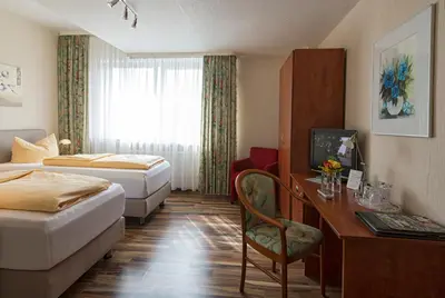 Ein Bett oder Betten in einem Zimmer der Unterkunft Hotel Monopol