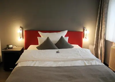 Ein Bett oder Betten in einem Zimmer der Unterkunft Hotel Schmerkötter