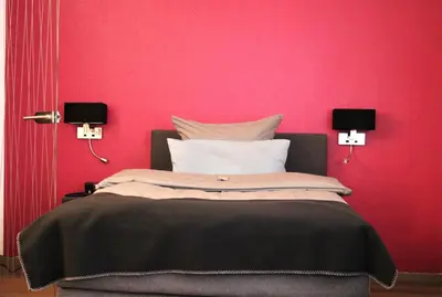Ein Bett oder Betten in einem Zimmer der Unterkunft Hotel Schmerkötter