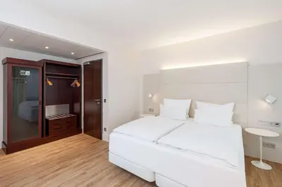 Ein Bett oder Betten in einem Zimmer der Unterkunft NH Düsseldorf City Nord
