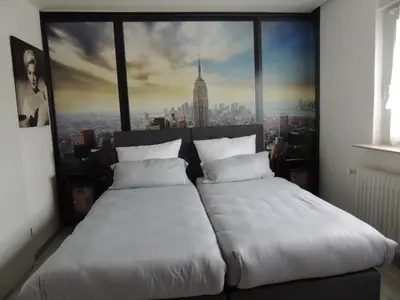 Ein Bett oder Betten in einem Zimmer der Unterkunft Gästehaus Holiday
