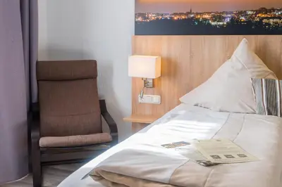 Ein Bett oder Betten in einem Zimmer der Unterkunft Hotel Restaurant Kromberg