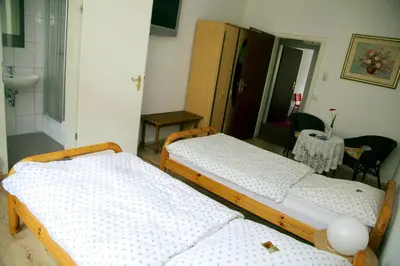 Ein Bett oder Betten in einem Zimmer der Unterkunft Hotel Hoffmann