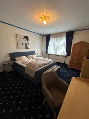 Ein Bett oder Betten in einem Zimmer der Unterkunft Hotel Fabritz