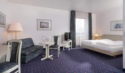 Ein Bett oder Betten in einem Zimmer der Unterkunft Wyndham Garden Duesseldorf Mettmann
