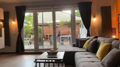 Ein Sitzbereich in der Unterkunft Stadtvilla Intzeplatz - Apartment Borkum