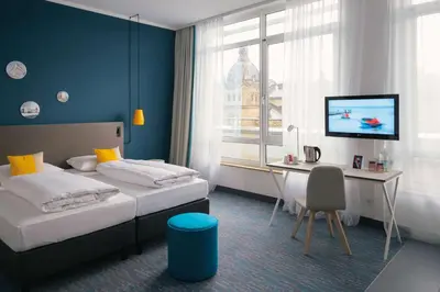 Ein Bett oder Betten in einem Zimmer der Unterkunft Vienna House Easy by Wyndham Wuppertal
