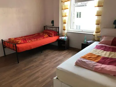 Ein Bett oder Betten in einem Zimmer der Unterkunft M/P