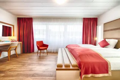 Ein Bett oder Betten in einem Zimmer der Unterkunft Hotel Senator