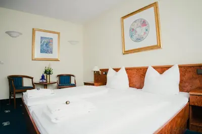 Ein Bett oder Betten in einem Zimmer der Unterkunft Altstadt Hotel St. Georg