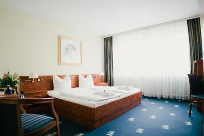 Ein Bett oder Betten in einem Zimmer der Unterkunft Altstadt Hotel St. Georg