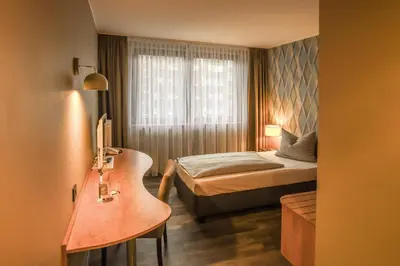 Ein Bett oder Betten in einem Zimmer der Unterkunft Eurostar Hotel