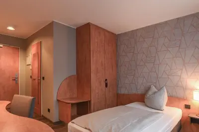 Ein Bett oder Betten in einem Zimmer der Unterkunft Eurostar Hotel