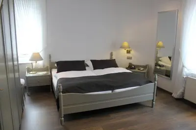 Ein Bett oder Betten in einem Zimmer der Unterkunft Hotel Goldener Stern