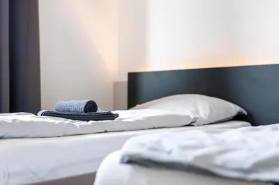 Ein Bett oder Betten in einem Zimmer der Unterkunft Glück Auf Appartements Düppelstraße