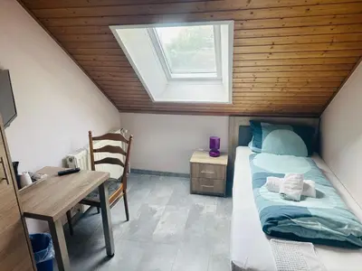 Ein Bett oder Betten in einem Zimmer der Unterkunft Hotel-Restaurant Olympia