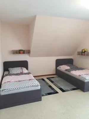 Ein Bett oder Betten in einem Zimmer der Unterkunft Ferienwohnung- Helena