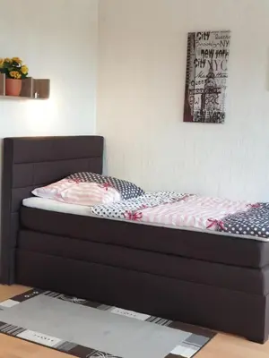 Ein Bett oder Betten in einem Zimmer der Unterkunft Ferienwohnung- Helena