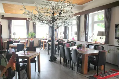 Ein Restaurant oder anderes Speiselokal in der Unterkunft Haus Kastanienhof