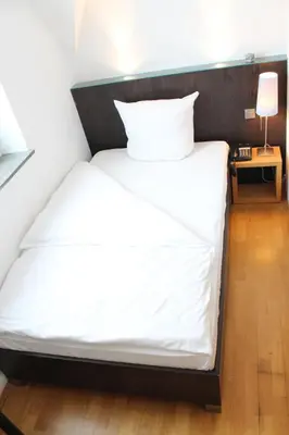 Ein Bett oder Betten in einem Zimmer der Unterkunft Hotel Lorenz