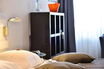 Ein Bett oder Betten in einem Zimmer der Unterkunft STADT HOTEL Iserlohn