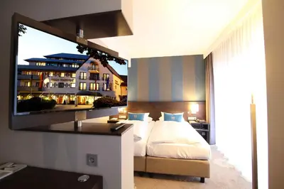 Ein Bett oder Betten in einem Zimmer der Unterkunft Parkhotel Wittekindshof