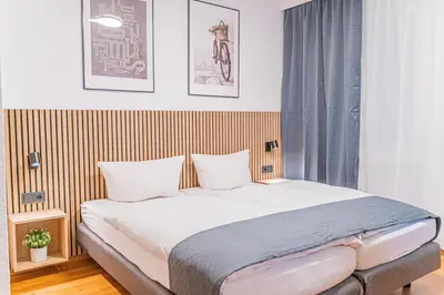 Ein Bett oder Betten in einem Zimmer der Unterkunft Hotel Solinger Hof