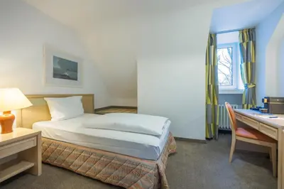 Ein Bett oder Betten in einem Zimmer der Unterkunft Fletcher Waldhotel Nordrhein-Westfalen