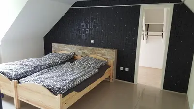 Ein Bett oder Betten in einem Zimmer der Unterkunft Ferienwohnung in Essen