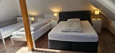 Ein Bett oder Betten in einem Zimmer der Unterkunft Ferienwohnung Mülheim Heißen mit großem Balkon