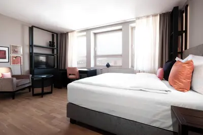 Ein Bett oder Betten in einem Zimmer der Unterkunft SAXX Hotel 
