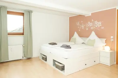 Ein Bett oder Betten in einem Zimmer der Unterkunft Ferienwohnung mit Kuschelflair
