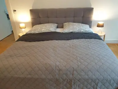 Ein Bett oder Betten in einem Zimmer der Unterkunft Apartment Villa Kronenberg