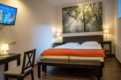 Ein Bett oder Betten in einem Zimmer der Unterkunft Hotel Birschel-Mühle