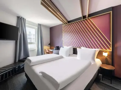 Ein Bett oder Betten in einem Zimmer der Unterkunft B&B HOTEL Wuppertal-City