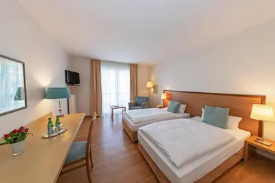 Ein Bett oder Betten in einem Zimmer der Unterkunft Thiesmann´s Hotel & Restaurant