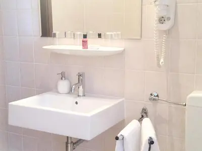 Ein Badezimmer in der Unterkunft Hotel Hölscher