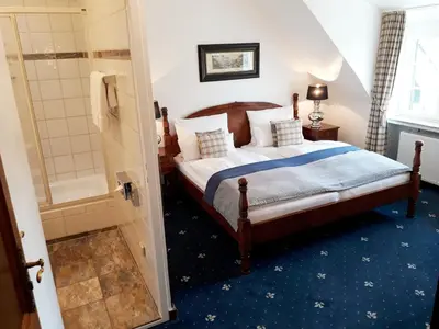 Ein Bett oder Betten in einem Zimmer der Unterkunft Boutique Hotel Windsor - The Charming City Hotels