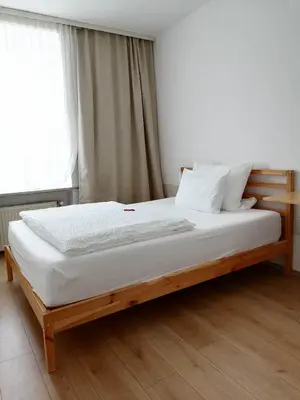 Ein Bett oder Betten in einem Zimmer der Unterkunft Hotel Hanseatic-garni