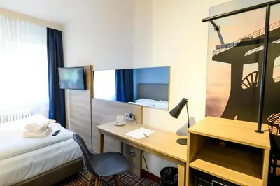 Ein Bett oder Betten in einem Zimmer der Unterkunft Hotel Ambassador Essen