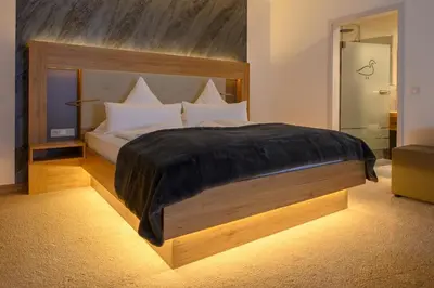 Ein Bett oder Betten in einem Zimmer der Unterkunft Landhotel Jagdschlösschen