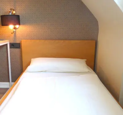 Ein Bett oder Betten in einem Zimmer der Unterkunft Hotel Akazienhof
