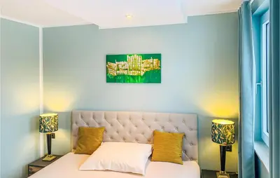 Ein Bett oder Betten in einem Zimmer der Unterkunft Nice Apartment In Mettmann With Wifi