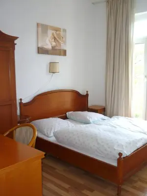 Ein Bett oder Betten in einem Zimmer der Unterkunft Artus Hotel