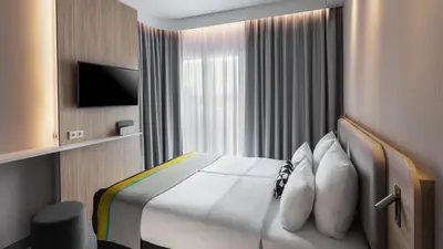 Ein Bett oder Betten in einem Zimmer der Unterkunft Holiday Inn Express Düsseldorf - Hauptbahnhof by IHG