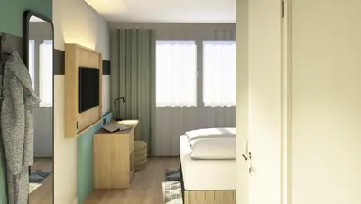 Ein Bett oder Betten in einem Zimmer der Unterkunft Spark by Hilton Essen City Centre