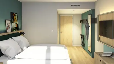Ein Bett oder Betten in einem Zimmer der Unterkunft Spark by Hilton Essen City Centre