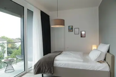 Ein Bett oder Betten in einem Zimmer der Unterkunft PM-AM Apartments GmbH