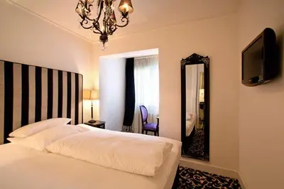 Ein Bett oder Betten in einem Zimmer der Unterkunft Hotel Aleksandra
