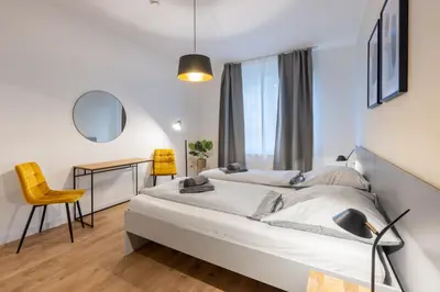 Ein Bett oder Betten in einem Zimmer der Unterkunft Glück Auf Appartements Hufelandstraße Essen